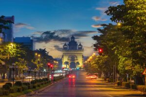 Laos, Vientiane | Kenzan Travel Vientiane Laos, sunrise city skyline at Patuxai (Patuxay) the most famous landmark in Vientiane
